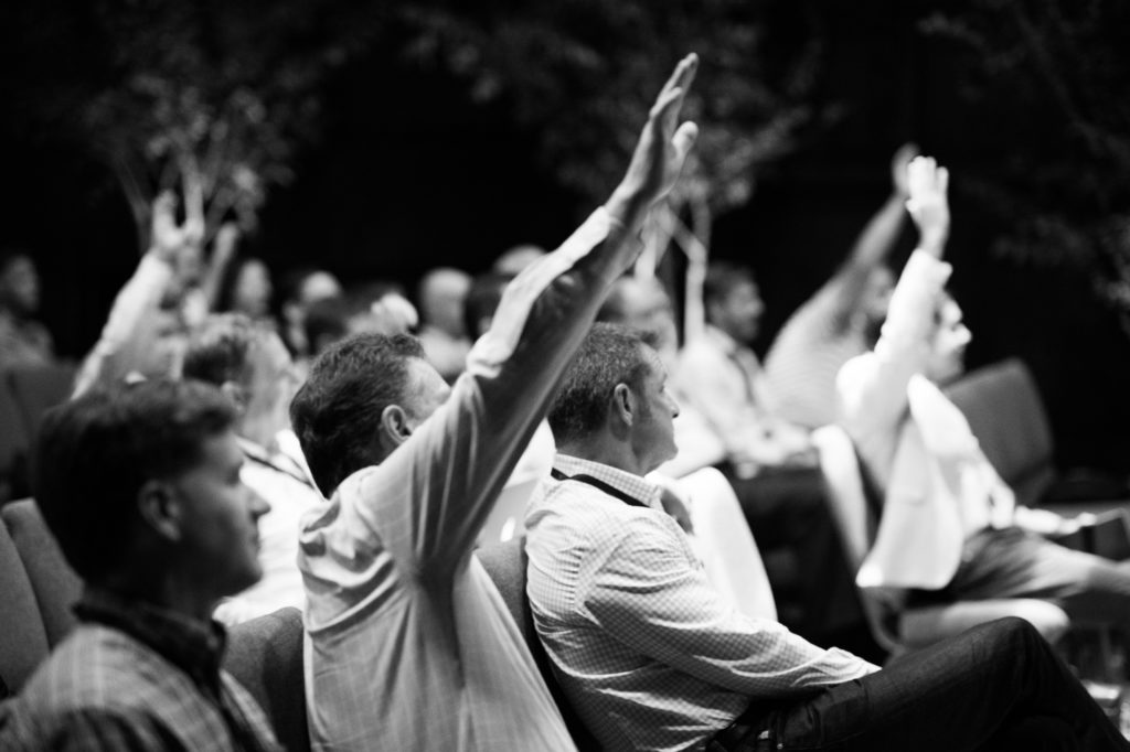 Why? - audience members raising their hands