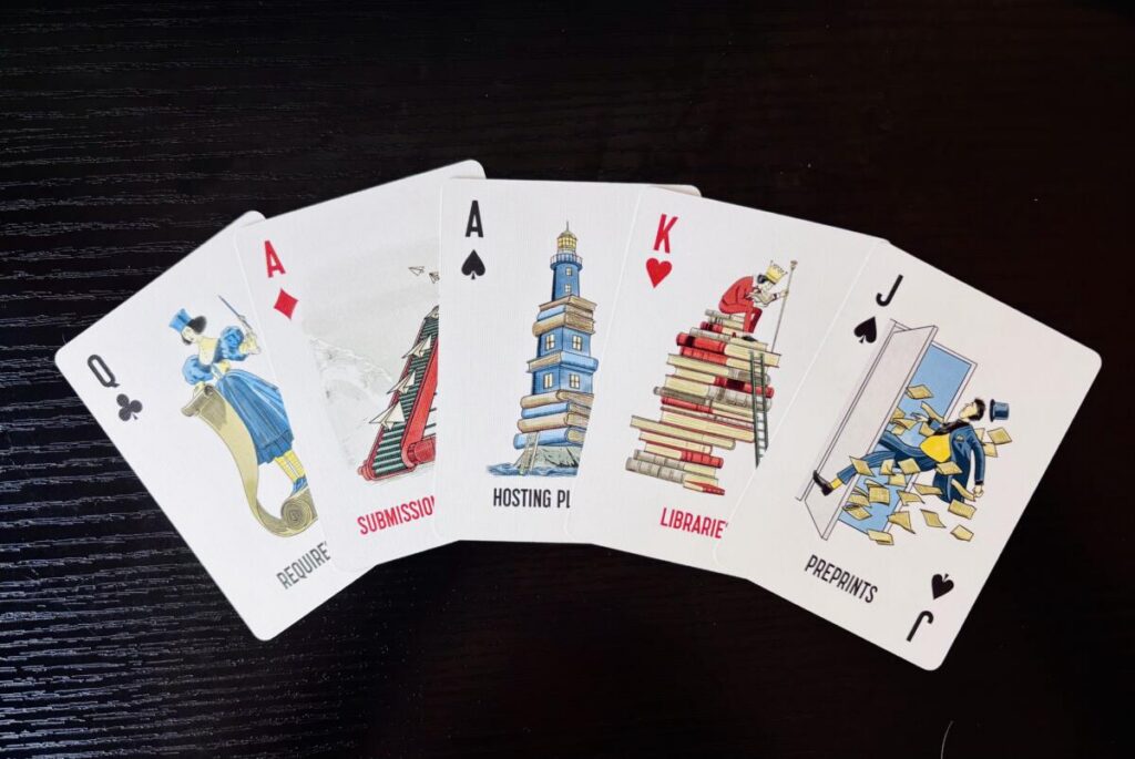 five cards fanned out on a desk